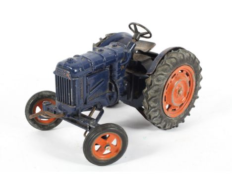 A Chad Valley 1/16 scale Fordson clockwork tractor, in blue and orange, 19cm long