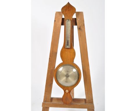 A 19th century wheel barometer, by Why &amp; Creek, Sandy, with silvered thermometer and main dial, height 95cm