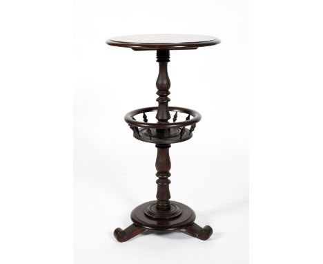 A Victorian mahogany two tier circular table, the lower shelf with bobbin turned spindles, 74cm high, 41cm diameter