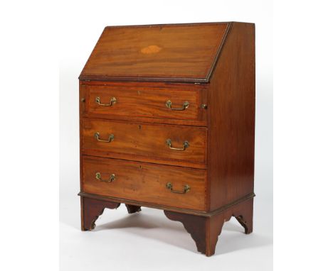 A George III mahogany inlaid bureau, late 18th century, the cross-banded fall front inlaid with satinwood shell marquetry, en