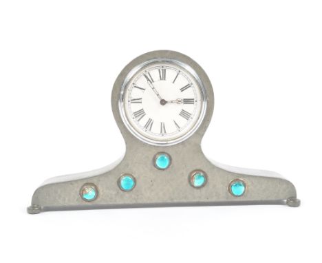 A Liberty Tudric pewter mantel clock case, with turquoise enamelled jewels, 12cm high, 20cm wide