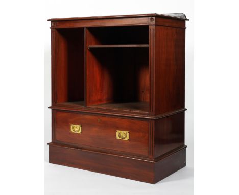 A Victorian mahogany campaign-style bookcase, late 19th century, flanked by reeded side panels, enclosing two divisions and o