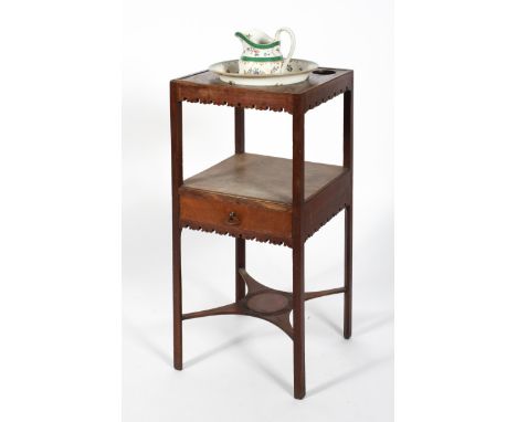 A Georgian mahogany washstand, late 18th century, the upper part with two small and one large aperture, fitted with later Sta