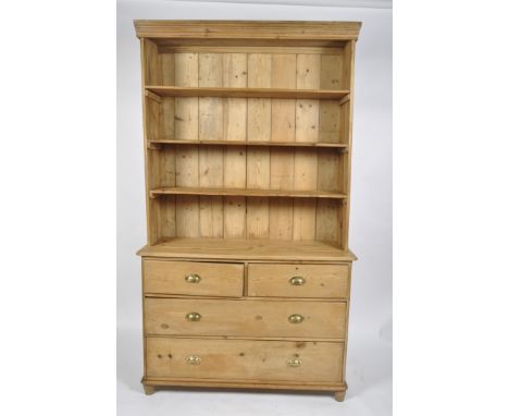 A Victorian pine dresser, the three shelf rack on a base with two short and two long drawers, 225cm high, 130cm wide, 47cm de