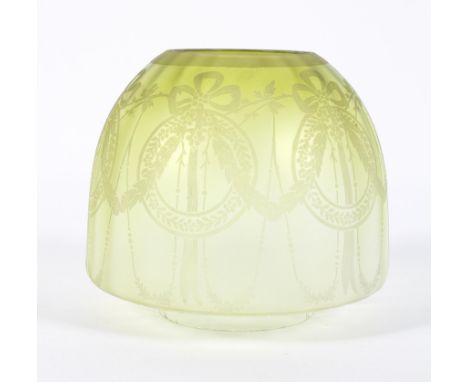 An Edwardian yellow lustre acid etched lamp shade, early 20th century, etched with ribbon tied swags, 17 cm high