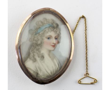A portrait miniature, early 19th century, in yellow metal brooch