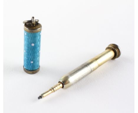 A late 19th/early 20th century yellow metal and enamel propelling pencil, the blue enamel decorated with white spots, 3cm lon