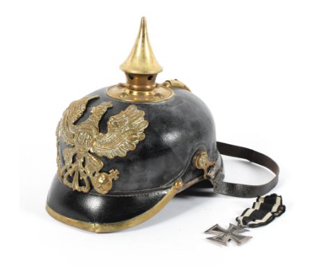 A German World War I Imperial Picklehaube helmet, together with a Uhlan Cavalry silver Iron Cross medal and a parachute; capt