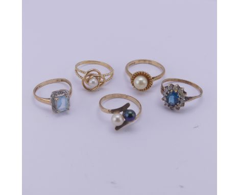 Three cultured pearl Rings, all mounted in 9ct yellow gold, together with a blue and white paste cluster ring and a pale blue