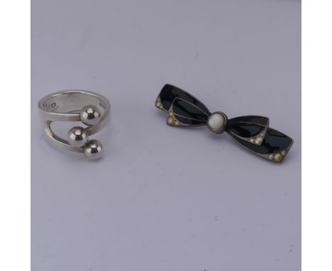 A Norwegian silver 'Jester' Ring, by Anna Greta Eker, marked 'AGE Sterling 925S Norway', c.1960's, Size L, together with a bl