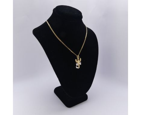 A 'Scorpio' Zodiac Pendant, in 18ct yellow and white gold set diamond points, 2.4cm long, on an 18ct gold chain, 49cm long,&n