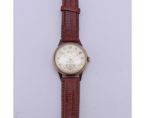 A vintage 9ct gold Accurist Wristwatch, the champagne dial with gilt Arabic numerals and hands, subsidiary seconds dial, 21-j