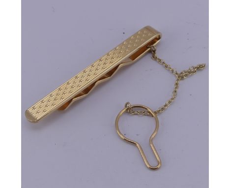 A 9ct yellow gold Tie Pin, with engine turned decoration, 7.5g. 