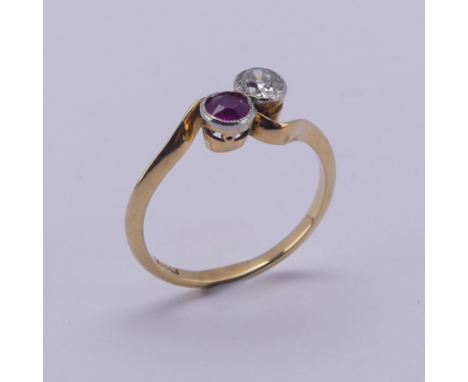 A ruby and diamond Ring,&nbsp;the old cut diamond approx. 0.2ct, millegrain set on the cross with a circular facetted ruby, a