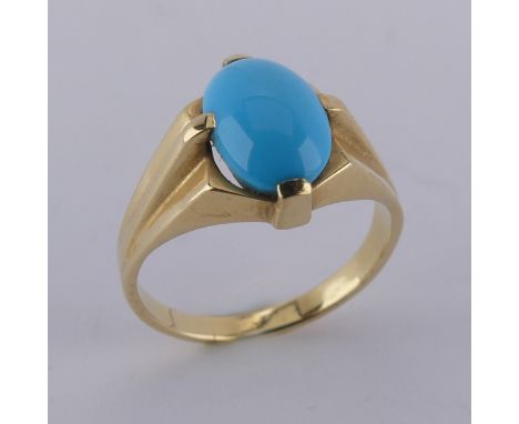 An oval cabochon turquoise Ring, the stone 10mm long, four claw set in modernist yellow gold mount, marked 750, Size N½, 4.8g