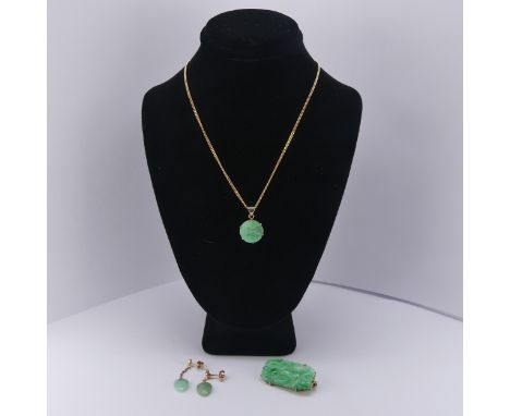 A 9ct gold mounted jade Pendant / Brooch, the pierced rectangular plaque 3cm long, together with a small circular 9ct gold mo