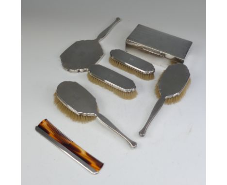 A George VI silver backed Hand Mirror, by&nbsp;William Comyns &amp; Sons Ltd., hallmarked London, 1947, together with two pai