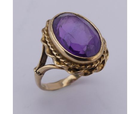 An oval facetted Dress Ring, in 9ct ropetwist mount and shank, Size K, approx. total weight 5.2g. 