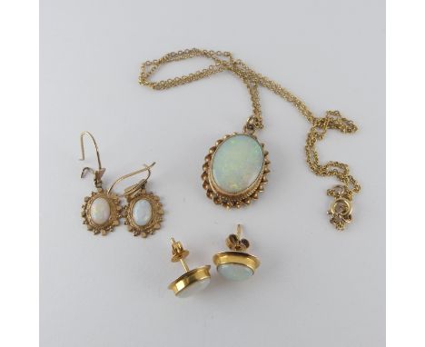 A 9ct gold mounted oval opal Pendant, the stone approx. 16mm long, in ropetwist mount, on 9ct gold trace chain, 41cm long, to