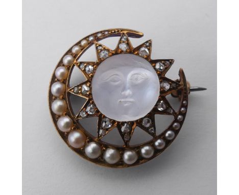A Victorian 'Man-in-the-Moon' Brooch, the central carved moonstone, 11mm diameter, within a star and crescent moon mount set 