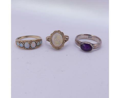 A graduated six stone opal Ring, mounted in 9ct yellow gold, Size N½, together with an opal cabochon ring, mounted in 9ct gol