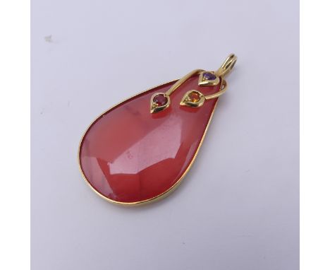 A jade Pendant, the pear shaped peach jade, with amethyst, citrine and garnet set surmount, all in unmarked yellow metal moun