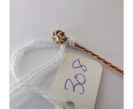 Gold mounted solitaire diamond stick pin    