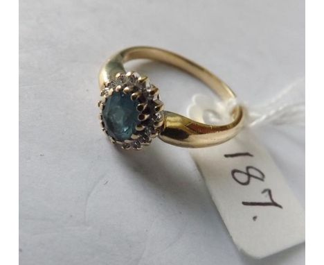 9ct oval blue topaz and diamond cluster   ring approx size O       