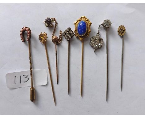 Seven old stick pins       