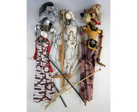 A pair of Siamese puppets and skeleton puppet 