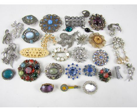 A large quantity of vintage costume jewellery brooches, including marcasite, paste set and Celtic plaid brooches, early to mi