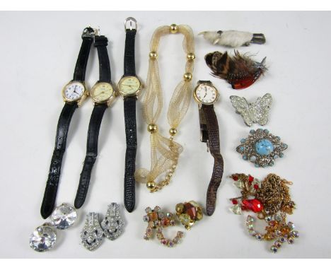 Four ladies' wristlet watches together with a white metal mounted grouse foot, costume earrings and vintage brooches etc