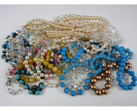 A large quantity of vintage and modern costume jewellery, including bone rosary beads, 1950s lustrous beads and faux pearls 