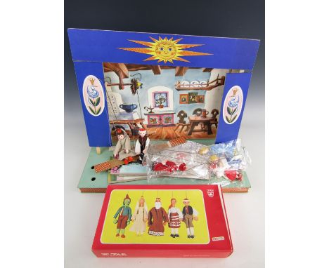 A puppet theatre together with boxed puppets
