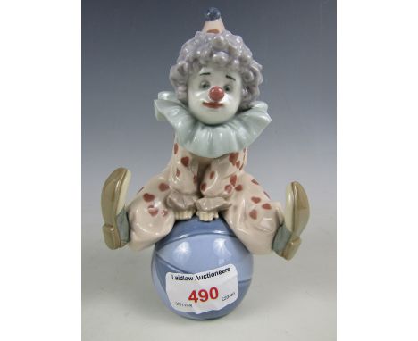 A Lladro figurine Having a Ball 5813