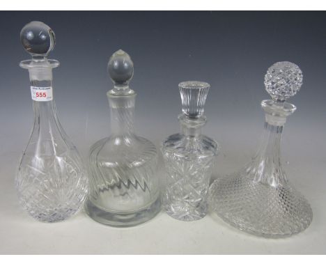 An Indian club decanter together with a ships decanter and two other glass decanters