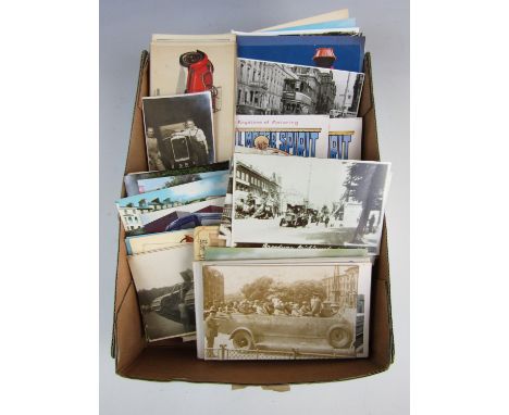 A quantity of vintage postcards depicting buses, cars and transport
