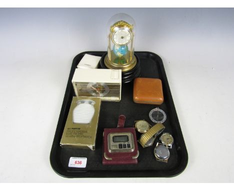 A Globus torsion clock together with vintage travel clocks and watches