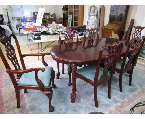 A contemporary mahogany dining table measuring 200cm by 100cm together with four reproduction Chippendale style mahogany dini