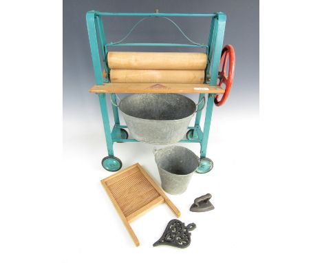 A vintage Triang toy mangle together with toy scrubbing board, a galvanised tub and pail, and an iron and trivet