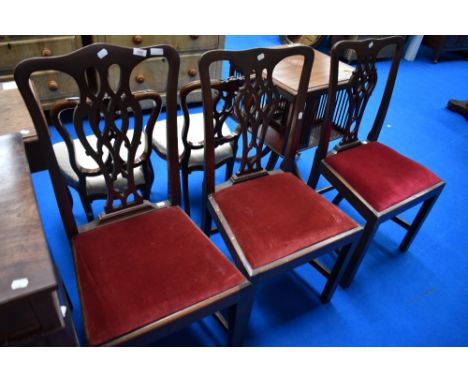 A set of three Chippendale style dining chairs having drop in seats and H stretchers