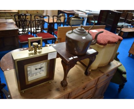 A small woven fibre ottoman, stained frame stool or occasional table, oversized mantel clock and copper kettle