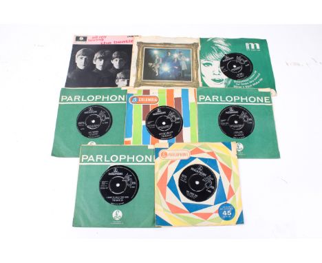 A collection of eight mostly early Beatles 7" 45 RPM vinyl singles. Including Parlophone - She Loves You / I'll Get You - R 5