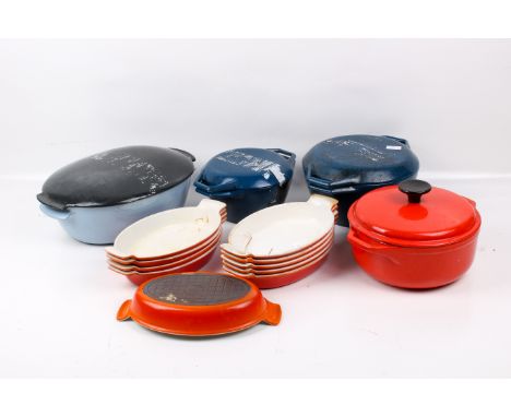 A collection of assorted vintage continental enamelled cast iron cookware. Including casserole dishes, etc. Max. H13cm