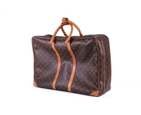 A vintage Louis Vuitton Sirius travel bag. 1996, labelled 'SP1907'. Monogram Canvas with natural leather trims, handles, gold