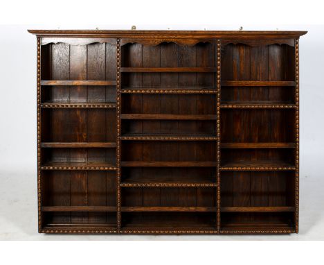 A late Victorian dark oak wall mounted plate rack. With bobbin turned mouldings. H115cm x W154cm x D18cm Condition Report: Ap