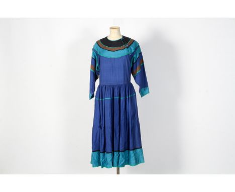 A ladies vintage 1970s 'Kenzo Paris' dress. The dress is coloured in greens, blues and browns and features striped decoration