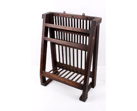A 19th century wooden wall mounted plate rack. H61cm x W46cm x D24cm