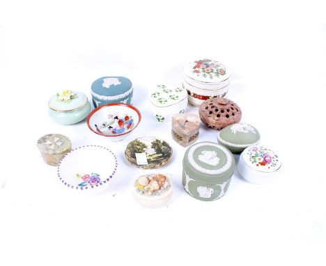 A collection of porcelain lidded boxes. Including three pieces of Wedgwood jasperware, a Royal Adderley pot with floral detai