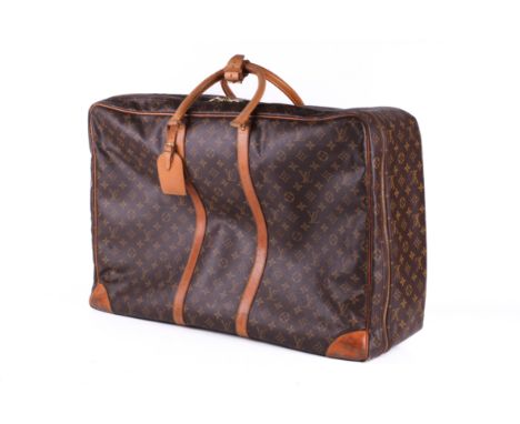 A vintage Louis Vuitton Sirius travel bag. 1997, labelled 'SP0937'. Monogram Canvas with natural leather trims, handles, gold